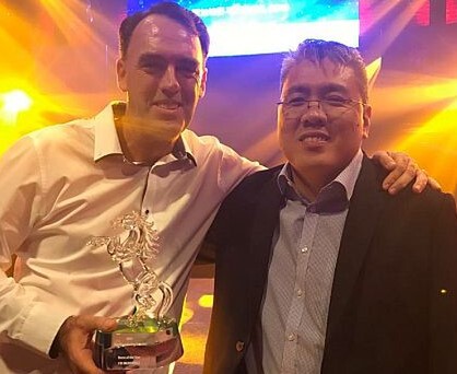 Trainer Shane Baertschiger and owner Desmond Ong of Doha Stable celebrate I’m Incredible’s award - Photo: Singapore Turf Club